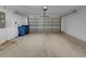 Spacious garage with an automatic door offering ample room for parking and storage at 18233 Portside St, Tampa, FL 33647