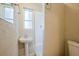 Small bathroom with pedestal sink and window at 2011 10Th S St, St Petersburg, FL 33705