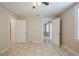 Bedroom boasts neutral walls, tile floors, and multiple doorways at 2011 10Th S St, St Petersburg, FL 33705