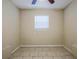 Neutral bedroom features tile flooring and a window at 2011 10Th S St, St Petersburg, FL 33705