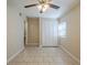 Bright bedroom with tile floor, ceiling fan, and ample closet space at 2011 10Th S St, St Petersburg, FL 33705