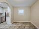 Dining area with stainless steel appliances, white cabinets and an arched entrance to the kitchen at 2011 10Th S St, St Petersburg, FL 33705