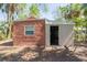 Small building with brick and cinder block walls at 2011 10Th S St, St Petersburg, FL 33705