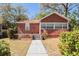 Charming brick home with a well-manicured front yard and walkway leading to the entrance at 2011 10Th S St, St Petersburg, FL 33705