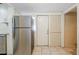 Kitchen includes stainless steel refrigerator and tile flooring at 2011 10Th S St, St Petersburg, FL 33705