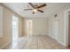 Spacious living area with tiled floors, built in shelves and seamless flow to other rooms at 2011 10Th S St, St Petersburg, FL 33705
