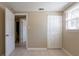 Bedroom featuring a closet, tile flooring and natural light from a window at 3207 N 45Th St, Tampa, FL 33605