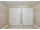 Bedroom with double door closet featuring tile floors at 3207 N 45Th St, Tampa, FL 33605