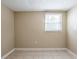 Bedroom featuring a neutral color palette, tile flooring and a window at 3207 N 45Th St, Tampa, FL 33605
