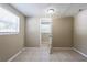 Neutral bedroom with tile floor and a window with horizontal blinds at 3207 N 45Th St, Tampa, FL 33605