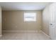 Bright bedroom with tile flooring and a window offering natural light at 3207 N 45Th St, Tampa, FL 33605