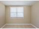 Bedroom featuring a neutral color palette, tile flooring and a window at 3207 N 45Th St, Tampa, FL 33605