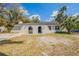 Charming one-story home features stucco and lush landscaping in a peaceful neighborhood at 3207 N 45Th St, Tampa, FL 33605