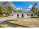 Charming one-story home features stucco and lush landscaping in a peaceful neighborhood at 3207 N 45Th St, Tampa, FL 33605