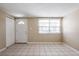 Spacious room showcasing the neutral interior and tile floors at 3207 N 45Th St, Tampa, FL 33605