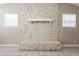 Bright living room featuring a stone fireplace and tile flooring at 3207 N 45Th St, Tampa, FL 33605