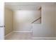 Stairwell featuring tile floors and a wooden handrail at 3207 N 45Th St, Tampa, FL 33605