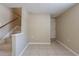 Stairwell featuring tile floors and a wooden handrail at 3207 N 45Th St, Tampa, FL 33605