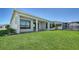 The backyard has a well-maintained lawn and neutral exterior at 4541 Mondrian Ct, Sarasota, FL 34240
