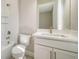 The bathroom features a tub with a glass shelf and a white vanity at 4541 Mondrian Ct, Sarasota, FL 34240