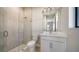 Bright bathroom with a glass shower and a single sink vanity at 4541 Mondrian Ct, Sarasota, FL 34240