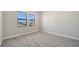 Bedroom featuring neutral walls, carpet flooring, and bright natural light at 4541 Mondrian Ct, Sarasota, FL 34240