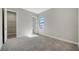 A clean and well-lit bedroom with neutral carpeting and paint at 4541 Mondrian Ct, Sarasota, FL 34240