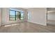 Spacious bedroom with modern design, offering ample natural light and a beautiful view of the waterfront through large windows at 4541 Mondrian Ct, Sarasota, FL 34240