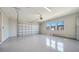 A spacious two car garage with an epoxy floor and three windows at 4541 Mondrian Ct, Sarasota, FL 34240