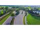 Gated entrance with a security gatehouse, lush landscaping, and a view of the surrounding community at 4541 Mondrian Ct, Sarasota, FL 34240
