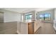 Well-lit kitchen with stainless appliances and a large island with seating overlooking an open floorplan at 4541 Mondrian Ct, Sarasota, FL 34240