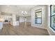 Open-concept living space with a bright kitchen, ample natural light, and modern laminate flooring that offers an open airy feel at 4541 Mondrian Ct, Sarasota, FL 34240