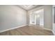 Spacious living room with wood floors flowing into an open concept design at 4541 Mondrian Ct, Sarasota, FL 34240