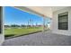 The patio overlooks a pond with a large grassy area at 4541 Mondrian Ct, Sarasota, FL 34240