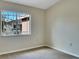 Neutral bedroom featuring a window that provides plenty of natural light at 523 Glenn Cross Dr, Ruskin, FL 33570