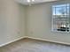 Bedroom featuring carpeted floors, neutral walls, and a window at 523 Glenn Cross Dr, Ruskin, FL 33570