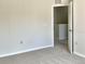 This neutral bedroom features base molding and plush carpeting at 523 Glenn Cross Dr, Ruskin, FL 33570