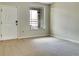 Spacious living room with neutral walls and new carpeting, offering a clean and inviting atmosphere at 523 Glenn Cross Dr, Ruskin, FL 33570