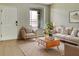 Inviting living room featuring neutral walls and a large window, creating a cozy and well-lit space at 523 Glenn Cross Dr, Ruskin, FL 33570