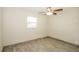 Bedroom with window and light colored wood-look tile flooring at 1501 Neil St, Plant City, FL 33563