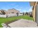 Spacious backyard featuring green grass and privacy fencing at 2303 Ashberry Ridge Dr, Plant City, FL 33563