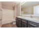 Bathroom with double sinks, modern vanity, and combined tub and shower at 2303 Ashberry Ridge Dr, Plant City, FL 33563