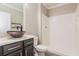 Bathroom featuring a vessel sink, decorative faucet, walk-in shower, and toilet at 2303 Ashberry Ridge Dr, Plant City, FL 33563