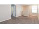 Bright bedroom with carpet flooring, closet space, and neutral wall color at 2303 Ashberry Ridge Dr, Plant City, FL 33563