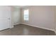 Bedroom with neutral walls, window with blinds, and a closet door at 2303 Ashberry Ridge Dr, Plant City, FL 33563