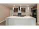 Stylish kitchen with a large center island, stainless steel appliances and pendant lighting at 2303 Ashberry Ridge Dr, Plant City, FL 33563