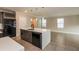 Modern kitchen boasts a breakfast bar, stainless steel appliances and ample storage space at 2303 Ashberry Ridge Dr, Plant City, FL 33563