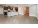 Spacious living area flows into kitchen with modern bar, perfect for entertaining at 2303 Ashberry Ridge Dr, Plant City, FL 33563