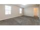 Spacious main bedroom with large windows, neutral walls and en-suite bathroom access at 2303 Ashberry Ridge Dr, Plant City, FL 33563
