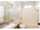 Bathroom with tub/shower combo, granite vanity, and a large mirror at 417 Dunaway Dr, Valrico, FL 33594